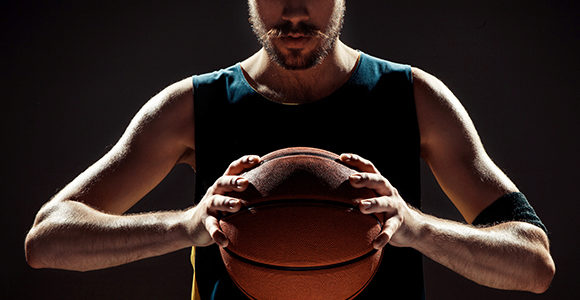 Picture of male athlete with a basketball